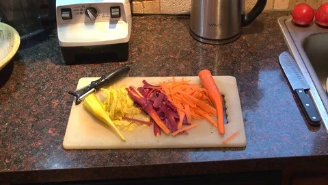 Peeling carrots slide Stock-Footage 119597904