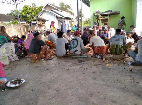 Peeling coconut with comunity Stock Photos