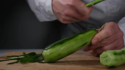 Peeling cucumber slow motion Stock Footage 254727763