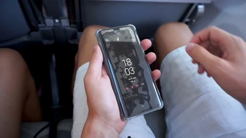 Peeling off Damaged Screen Protector from Smartphone Destroyed on an Airplane Stock Footage 125834677
