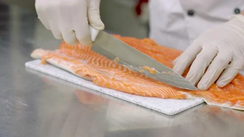 Peeling fish fillets with a knife Stock Footage 150090535