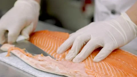Peeling fish fillets with a knife Stock Footage 150429644