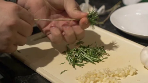 Peeling Off Fresh Rosemary From a Stem Stock Footage 85300159