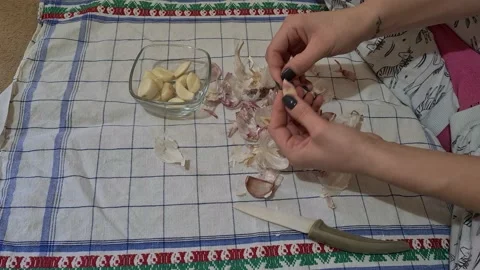 Peeling garlic Stock Footage 152410979