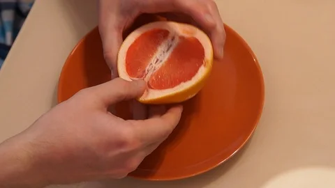 Peeling Grapefruit. Clean the grapefruit Stock Footage 86507295