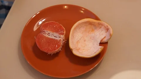 Peeling Grapefruit. Clean the grapefruit Stock Footage 86507364