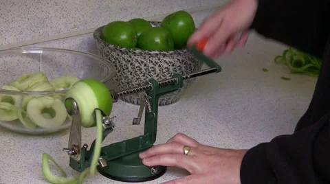 Peeling Green Apple with Automatic Peeler and Core Remover Stock Footage 33599356