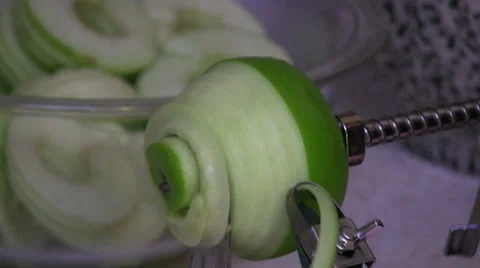 Peeling Green Apple with Automatic Peeler and Core Remover Stock Footage 33601549
