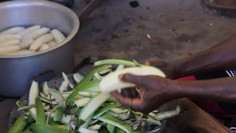 Peeling green bananas to be cooked 스톡 동영상 149444645