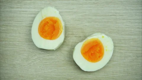 Peeling hard boiled egg. Half cut. Stop motion animation Video stock 297693721