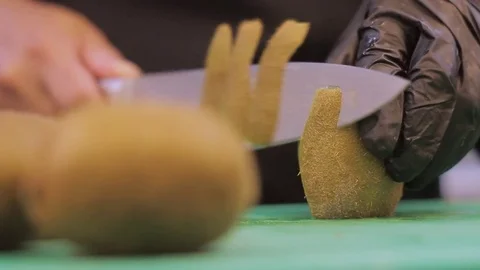 Peeling kiwis Stock Footage 74502420