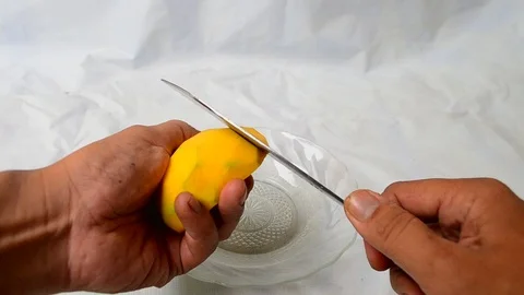 Peeling a mango Stock Footage 119739986