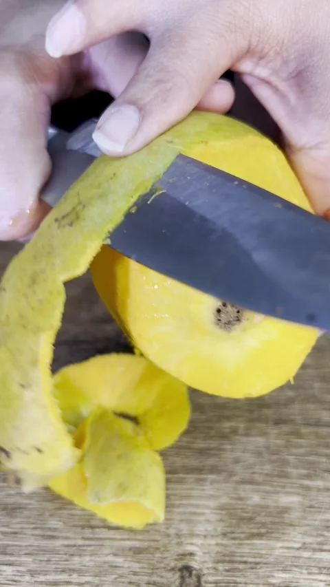 Peeling Mango with knife on a chopping board. peeling mango. mango isolated. Stock Footage 287811247