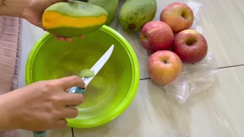 Peeling a Mango with a Knife Stock Footage 292726034