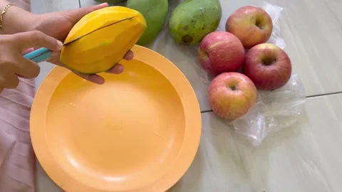 Peeling a Mango with a Knife Stock Footage 292726645