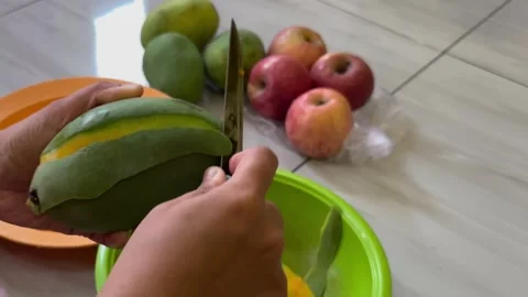 Peeling a Mango with a Knife Stock Footage 292726998