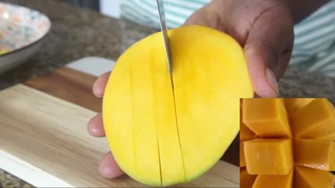 Peeling mangoes Stock Footage 243910786