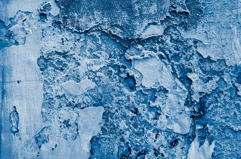 Peeling multi-layer painted wall.  toned  in classic blue trendy color of the Stock Photos