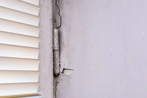 Peeling old paint on window slopes needed to be repared and repainted Stock Photos