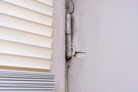 Peeling old paint on window slopes needed to be repared and repainted Stock Photos