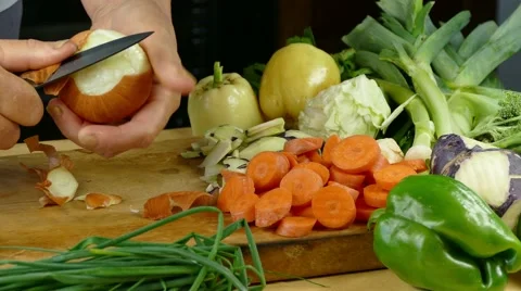 Peeling onion on desk in the kitchen Stock Footage 68068772