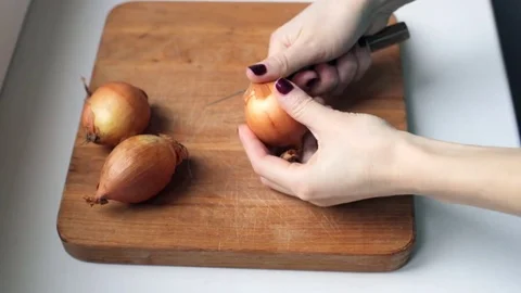 Peeling the onion at home Stock Footage 74010391
