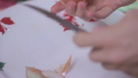 Peeling an onion with a knife colored Stock Footage 75612516