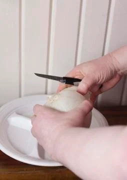 Peeling an Onion Stock-Fotos