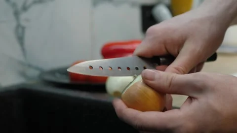Peeling onion with sharp knife Video stock 323656243