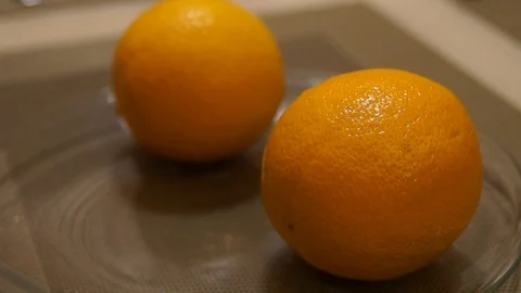 Peeling Orange. Hands peeling fruit. Fresh orange. Healthy food Stock Footage 99331369