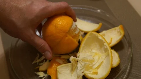 Peeling Orange. Hands peeling fruit. Fresh orange. Healthy food Stock Footage 99331576