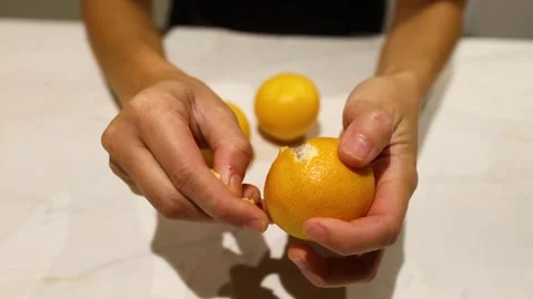 Peeling an Orange in Melbourne Stock Footage 300323858
