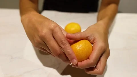 Peeling an Orange in Melbourne Stock Footage 301582103