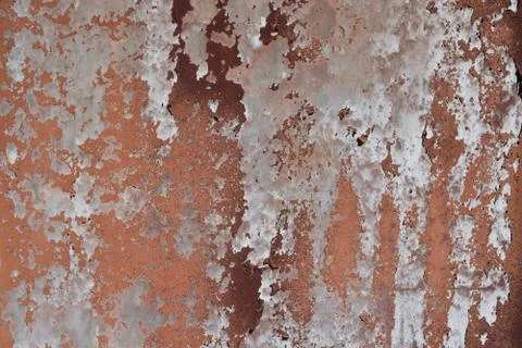 Peeling paint on cement wall texture. Pattern of rustic red grunge. Stock Photos