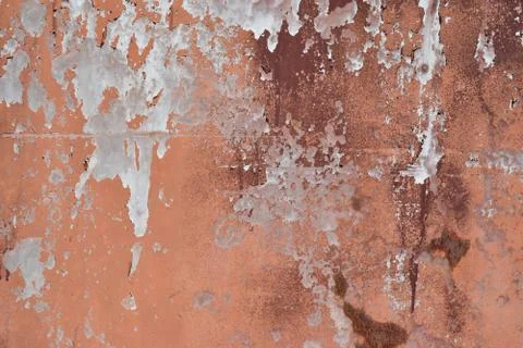 Peeling paint on cement wall texture. Pattern of rustic red grunge. Stock Photos