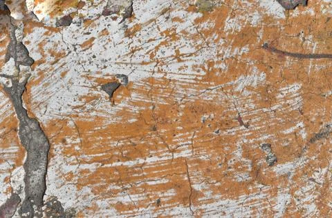 Peeling paint on cement wall texture. Pattern of rustic orange grunge. Stock Photos