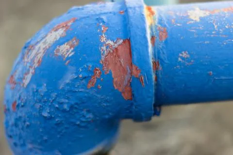 Peeling paint on the side of a pipe Stock Photos
