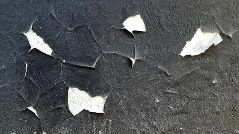 Peeling paint on vintage surface. Pattern of rustic grunge material Stock Photos