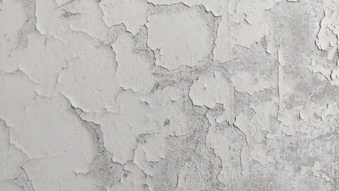 Peeling paint wall texture with large cracked patches and exposed plaster Stock Photos