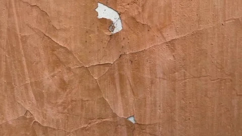 Peeling paint on the wall. Weathered rough painted surface Stock Footage 262862168