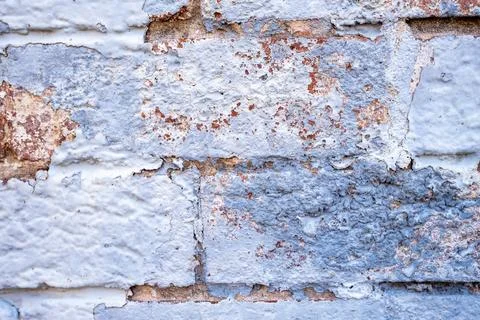 Peeling Painted Brick Wall Texture with Cracks and Weathering Stock Photos