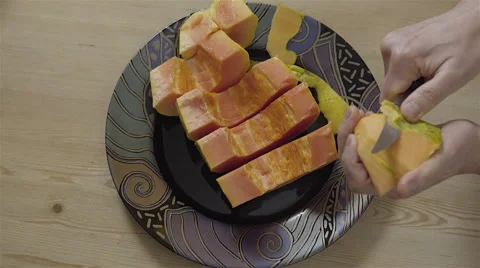 Peeling a Papaya fruit. 4K UHD. Stock Footage 49733125