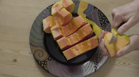 Peeling a Papaya fruit. 4K UHD. Stock-Footage 49733866