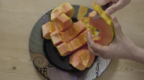 Peeling a Papaya fruit. 4K UHD. Stock-Footage 49735916