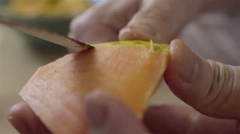 Peeling a Papaya fruit. 4K UHD. Stock-Footage 49736776