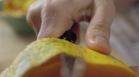 Peeling a Papaya fruit. 4K UHD. Stock-Footage 49738240