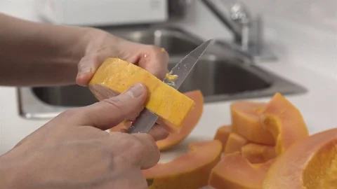 Peeling a Papaya fruit. Stock Footage 77739092