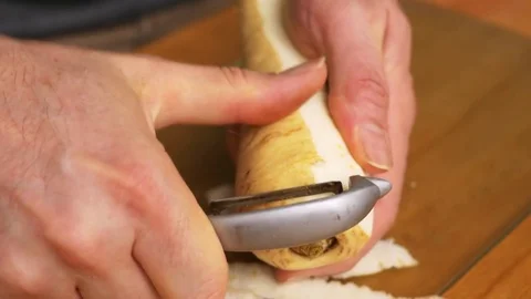 Peeling a parsnip root Stock Footage 71486918