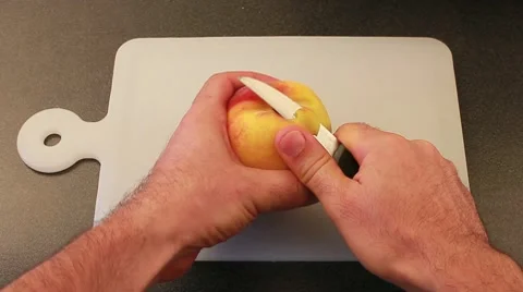 Peeling a peach Stock Footage 8569900