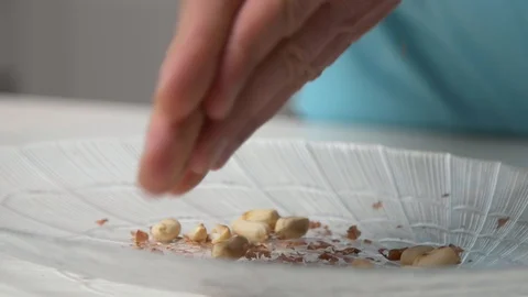 Peeling peanuts using palms in the kitchen Stock Footage 122516628
